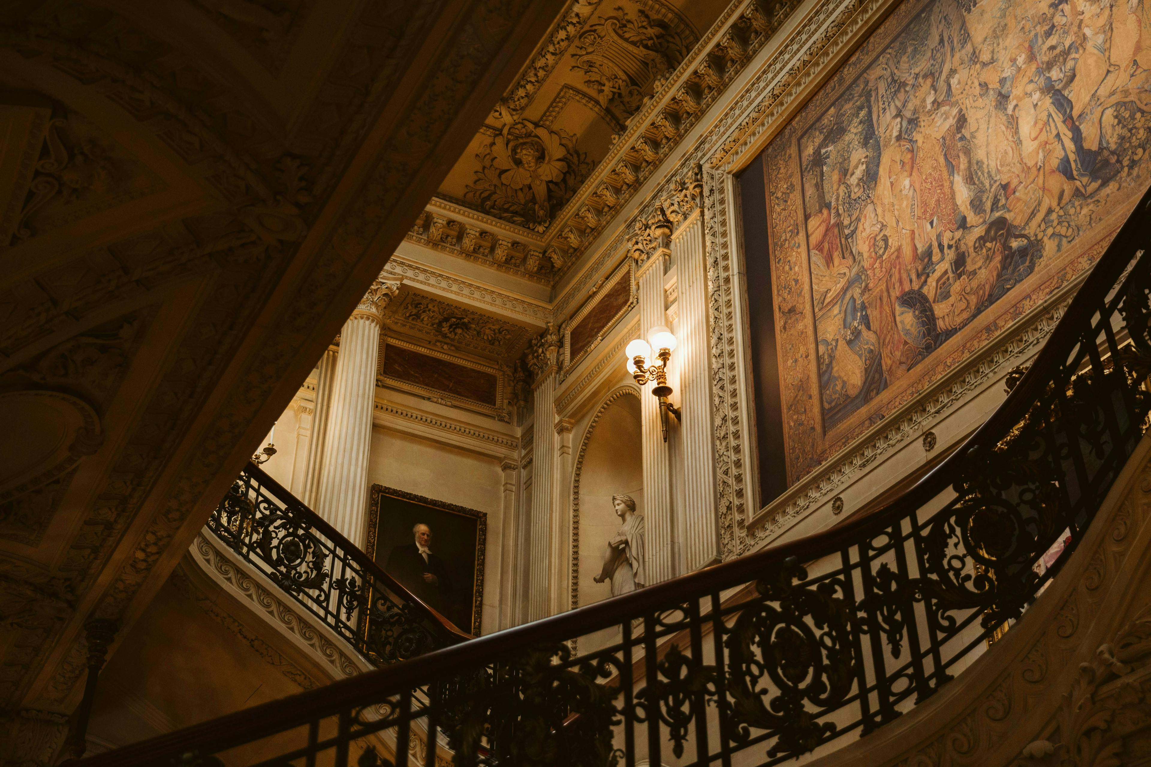 Photograph of the inside of The Breakers Mansion in Newport, RI. Photo by Kristina Delp via Unsplash.